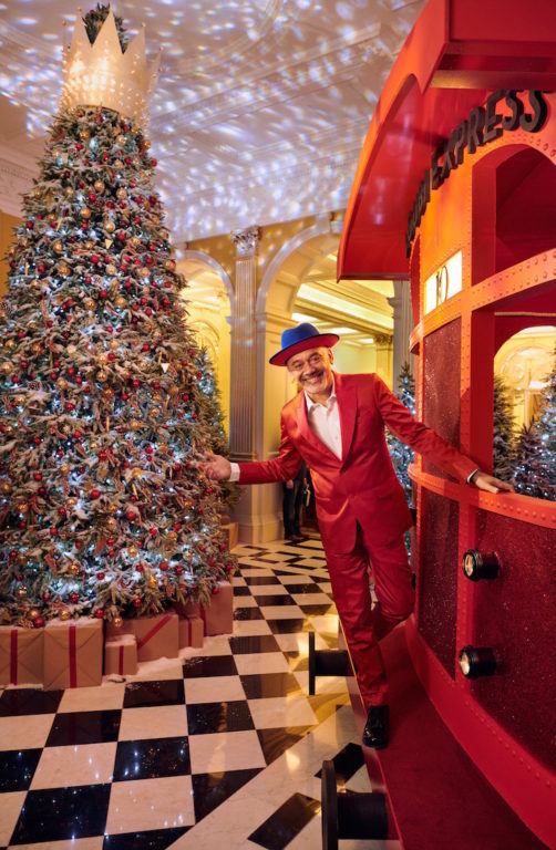 Claridge’s 2019 Christmas Tree by Christian Louboutin featuring the Loubi Express red train and gold-crowned tree.