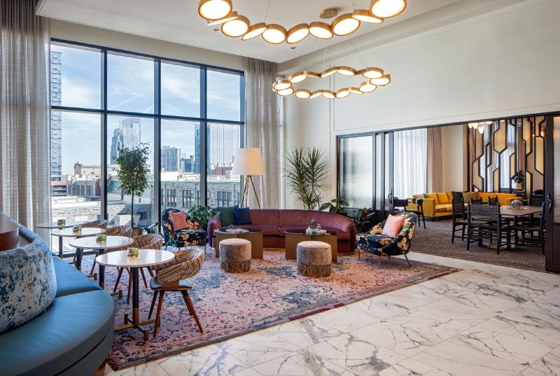 Cozy boutique hotel lobby featuring soft textures and warm lighting evoking home comfort.