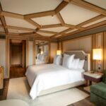 Guest bedroom at The Park Gstaad hotel in Switzerland, part of the historic property reopening as a Four Seasons hotel for winter 2026–27