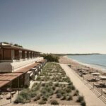 Seaview Terrace Suite at Dexamenes with folding floor-to-ceiling windows opening to a wide veranda