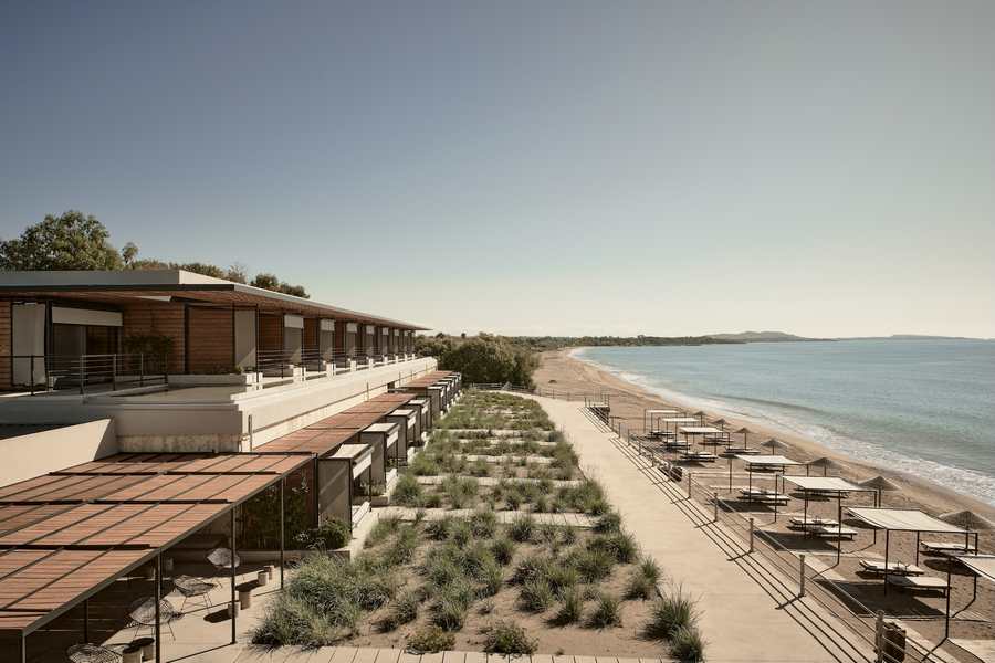 Seaview Terrace Suite at Dexamenes with folding floor-to-ceiling windows opening to a wide veranda
