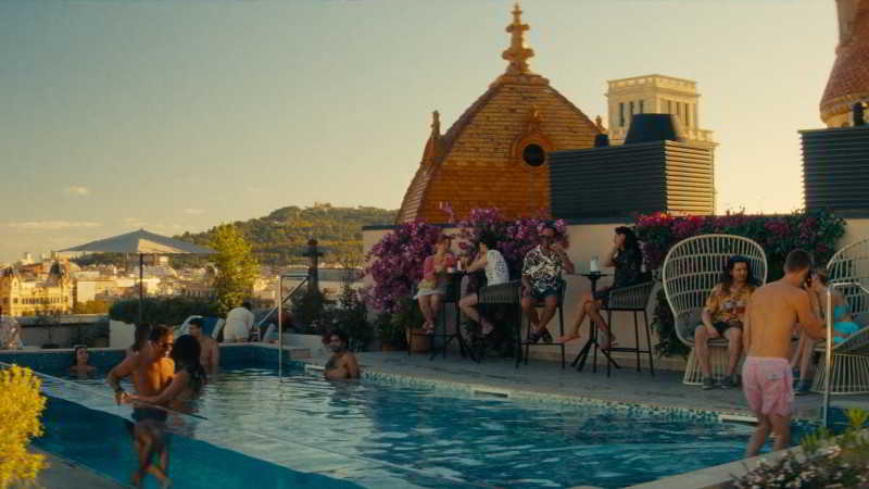 People we meet on vacation scene at ME Barcelona rooftop pool