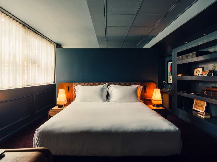 Aethos Milan redesigned guest room with layered headboard and bespoke furniture