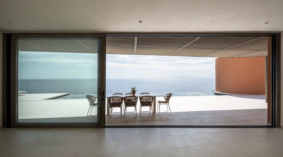 Outdoor living area with Aegean views at Olen Syros